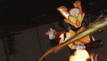 a statue of a person holding a sword with a flame coming out of it