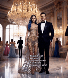 a man in a tuxedo stands next to a woman in a dress that says goodnight