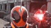 a person with a helmet on holding a red object that says ' e1 ' on it