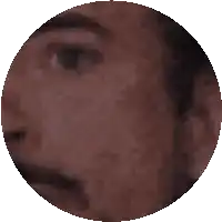a close up of a person 's face in a pixelated circle