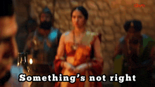 a blurred image of a woman with the words something 's not right