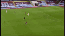 a soccer game is being played on a field with a banner that says part of the pride
