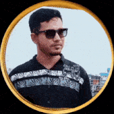a man wearing sunglasses and a shirt that says zinc plus edition 63