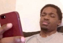 a man is taking a selfie with his cell phone .