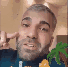 a man with a beard is pointing at his nose