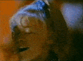 a close up of a person 's face with their eyes closed