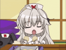 a girl in a nurse 's outfit is sitting at a table with her mouth open
