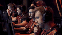 a group of men wearing bose headphones are playing a game