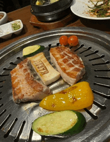 a plate of food with a piece of bread that says " pacific " on it
