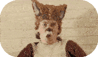 a man in a fox costume making a surprised face