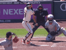a baseball player with the number 1 on his jersey is swinging his bat