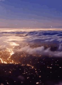 Rolling Clouds Above City Lights GIF - Weather Rollingclouds Citylights GIFs
