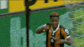 a man wearing a hat and a jersey with the number 8 on it