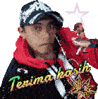 a man wearing a hat and a hoodie with the words terima kasih written on it