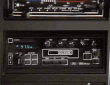 a close up of a car radio that says 97.5 fm on the screen