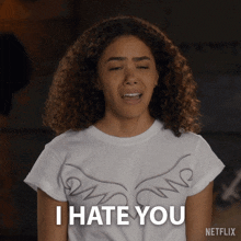 a woman wearing a t-shirt that says i hate you on it