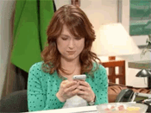 Receiving A Happy Text - The Office GIF - The Office Erin Hannon Ellie Kemper GIFs
