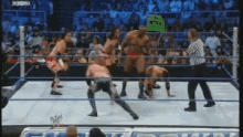 wrestlers in a ring with a sign that says " i 'm not a witch "