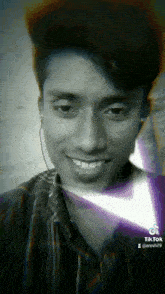 a black and white photo of a young man with a tiktok watermark