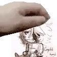 a hand is holding a drawing of a person 's face .