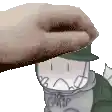 a person is petting a cartoon character with a hat on his head .