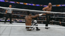 a wrestler in a ring with the word aew on the ropes
