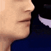 a close up of a woman 's face with a purple arrow on her cheek .