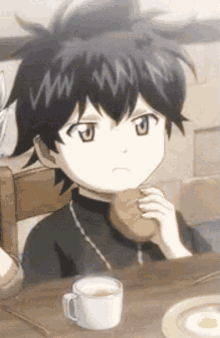 a boy is sitting at a table with a cup of coffee and a plate of food