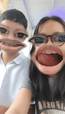 a boy and a girl are making funny faces and the girl is wearing a shirt that says abercrombie