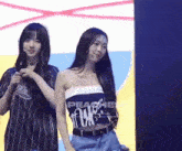 two girls are standing next to each other with one wearing a shirt that says peach on it