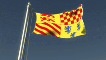 a yellow red and blue flag with a lion on it