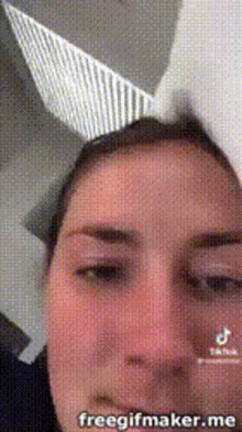 a close up of a woman wearing bunny ears