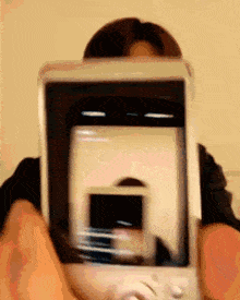 a person is taking a picture of themselves with a phone