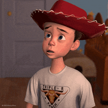 a boy wearing a cowboy hat and a triple r ranch t-shirt
