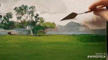 a person is holding a spatula in front of a painting of a field and trees made in animatica