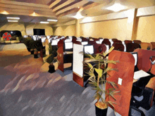 a painting of an office with cubicles and a fan on the wall