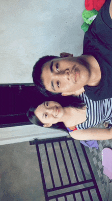 a man and woman are posing for a picture together