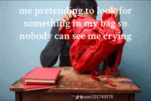 a man is sitting at a desk with a red backpack and a caption that says " me pretending to look for something in my bag "