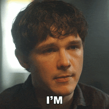 a close up of a man 's face with the words " i 'm " below him