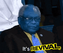 a man in a suit and tie with the words it 's revival on the bottom