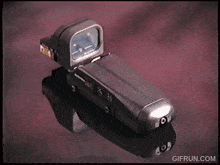 a gif from gifrun.com shows a reflection of a camera