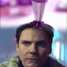 a man with a purple object on his head