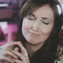 a close up of a woman wearing headphones