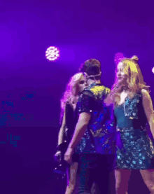 a man and a woman are dancing together on a stage