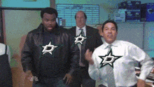 a man in a white shirt with a star on it