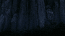 a boy and a girl are standing next to each other with the girl covering her mouth