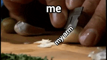 a person is cutting a piece of garlic on a cutting board with the words me my arm above them