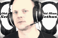 a man wearing headphones with the words old man gethus written on the background