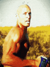 a man without a shirt is standing in a field holding a can of gatorade