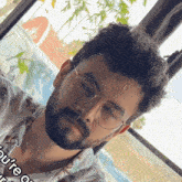 a man with a beard wearing glasses and a shirt that says " you 're on "